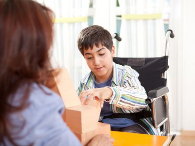 Physical therapy with a disabled child