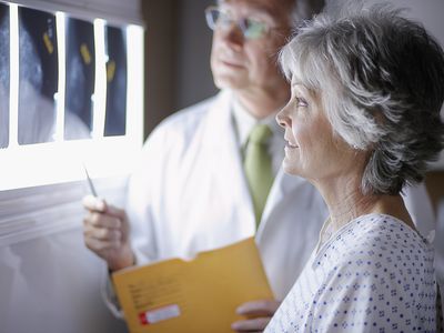 Woman reviewing X-Rays with doctor