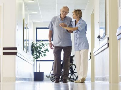 An ambulatory patient and his nurse.