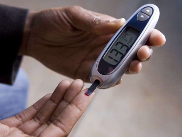 Performing a blood glucose test with a finger prick