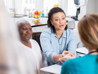 Senior woman's daughter visits with her mother's nurse