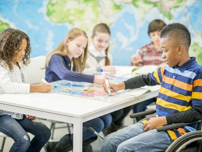 Children Coloring a World Map