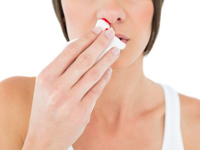 Closeup mid section of a woman with bleeding nose