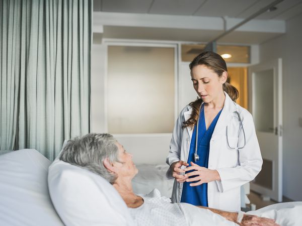 Female doctor checking on a patient