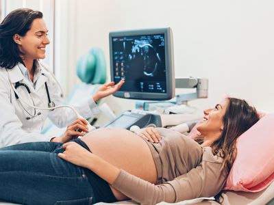 Pregnant young mom getting sonogram