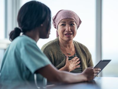 Medical professional talking with a woman