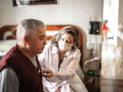 Man getting his heart checked by a doctor.