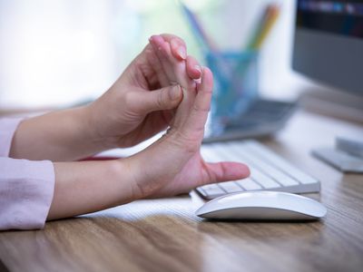 woman stretching fingers back