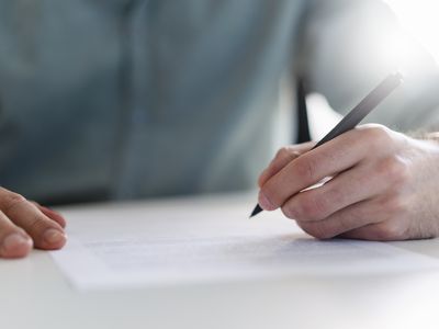 a man filling out paperwork