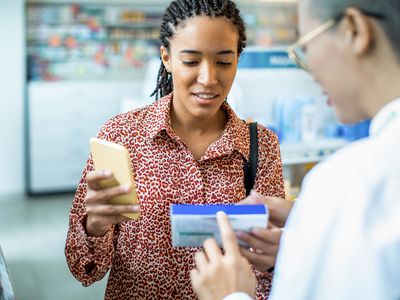 Customer and pharmacist discussing a product