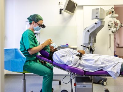 Eye surgeon and person being treated at an ambulatory surgery center