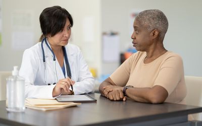 Person talking to healthcare provider about prediabetes screening