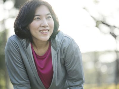 Woman taking a break from exercising outdoors