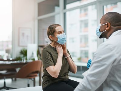 Shot of a mature doctor having a consultation with his patient - stock photo