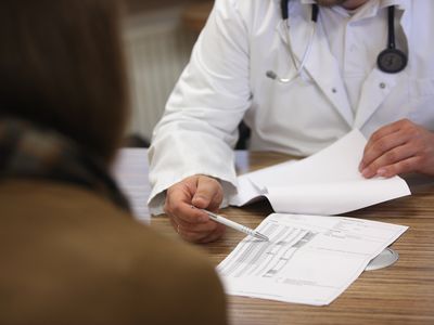 Doctor helping patient