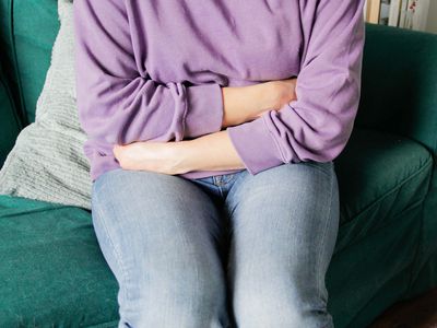 close-up of woman with stomach pain