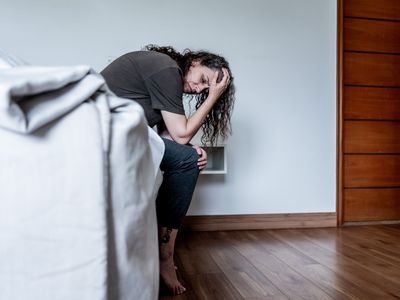 person sitting on bed