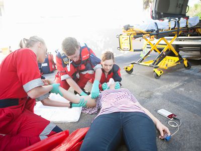 paramedics treating patient