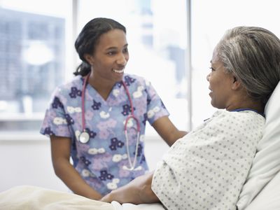 Nurse talking to patient in hospital