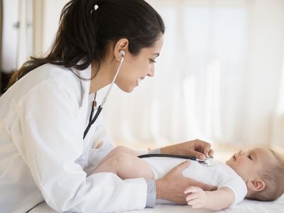 Doctor examining baby