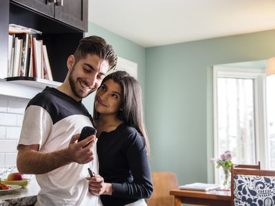 Couple checking diabetes blood sugar level