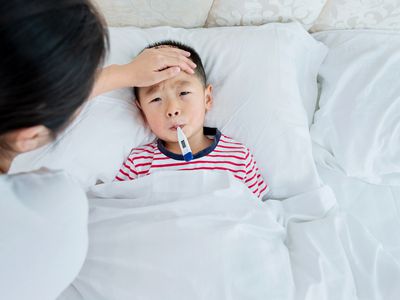 mother Checking son's temperature