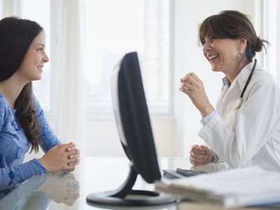 woman talking with doctor