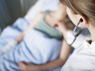 patient and doctor with stethoscope