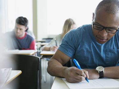 Group of college students taking exam.