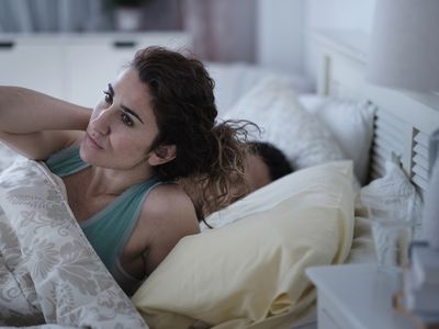 woman awake in bed