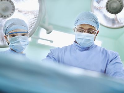 A surgeon looking at an operating table