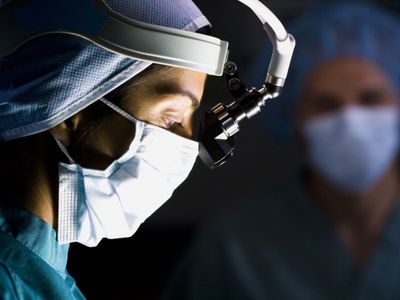 Surgeon working on patient