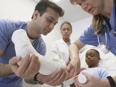 Little boy getting a cast on his leg