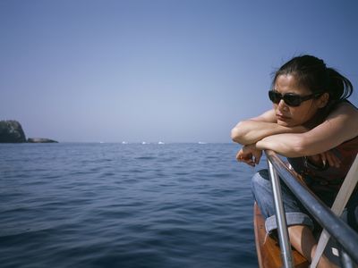 Woman seasick on a boat