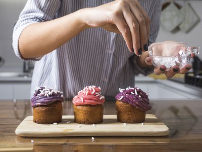 Woman preparing cupcakes at home