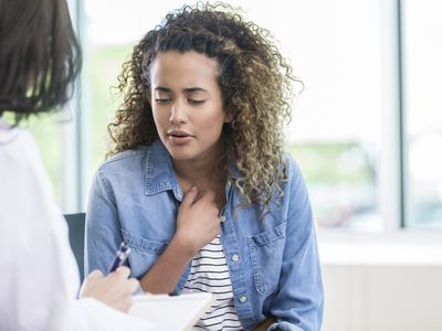 Woman speaking with healthcare provider