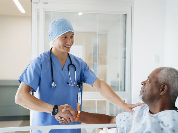 Patient shaking hands with doctor