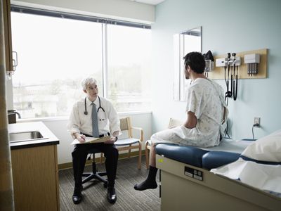 doctor talking to patient in exam room