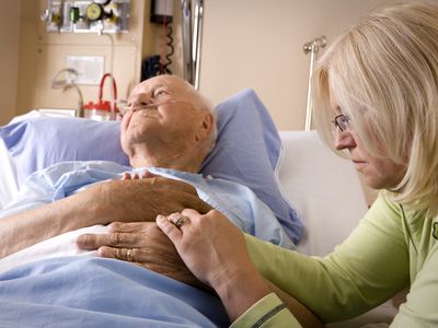 Elderly man in hospital bed