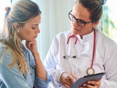 Doctor consulting with her patient