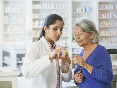 Pharmacist talking to customer