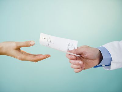 prescription being handed to a patient