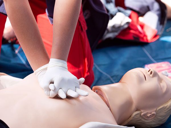 Midsection Of Woman Practicing On Dummy