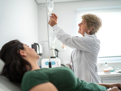 A person receives a saline IV