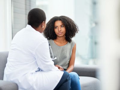 How to Practice Self-Advocacy at Doctor's Appointments: Young woman talking to a doctor