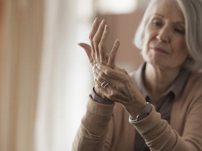 Senior Caucasian woman rubbing her hands