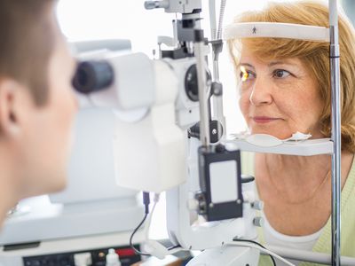 Senior woman visiting optician.