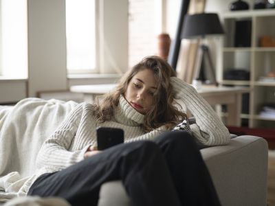 A person on a phone in a home