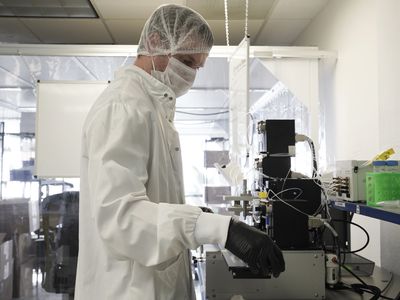 A lab technician manufactures Accula SARS-CoV-2 testing kits at a Mesa Biotech Inc. facility in San Diego, California, U.S., on Friday, March 27, 2020. 