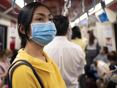 A person with a mask on public transportation